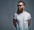 Bearded handsome man with sunglasses looking over Royalty Free Stock Photo
