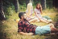 Bearded handsome man and two pretty cute girls or women outdoor on sunny day on forest background Royalty Free Stock Photo