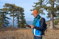 Bearded hiker looking at map