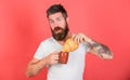 Bearded hipster enjoy breakfast drink coffee. Gastronomic pleasure. Man start morning with cup of coffee and fresh Royalty Free Stock Photo