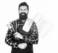 Bearded hipster wear apron for barbecue. Roasting and grilling food. Man hold cooking utensils barbecue. Tools for Royalty Free Stock Photo