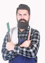 Bearded hipster wear apron for barbecue. Roasting and grilling food. Man hold cooking utensils barbecue. Tools for Royalty Free Stock Photo