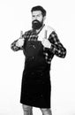 Bearded hipster wear apron for barbecue. Roasting and grilling food. Man hold cooking utensils barbecue. Tools for Royalty Free Stock Photo