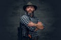 Bearded hunter holds a rifle. Royalty Free Stock Photo