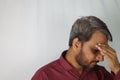 Bearded Indian man worried about white hair and hair loss at a young age Royalty Free Stock Photo