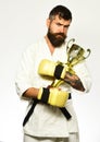 Bearded karate man or brutal caucasian hipster with moustache Royalty Free Stock Photo