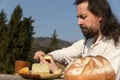 Bearded and long-haired man making a light meal Royalty Free Stock Photo