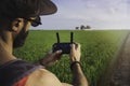 Bearded male model use drone remote control to fly device in air. Man operating drone flying in nature. New technologies Royalty Free Stock Photo