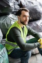 Bearded male worker in fluorescent vest