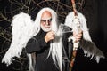 Bearded Man with angel wings. Senior man posing with angel wings. Tree spirit and fantasy concept. Ancient alchemy