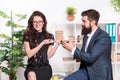 Bearded man and attractive woman. Man and woman conversation coffee time. Office rumors. Office coffee. Couple coworkers Royalty Free Stock Photo