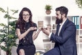 Bearded man and attractive woman. Man and woman conversation coffee time. Office rumors. Office coffee. Couple coworkers Royalty Free Stock Photo