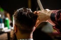 Bearded man in barber shop. Work in the barber shop. Man hairstylist. Hairdresser cutting hair of male client. Man Royalty Free Stock Photo