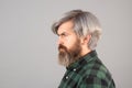 Bearded man. Barbershop procedures. Side view portrait.