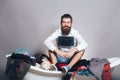 Bearded man on bath with wooden board Royalty Free Stock Photo