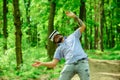 Bearded man with beard wear VR glasses on sunny outdoor. Bearded man with mobile gadget travel in summer forest Royalty Free Stock Photo