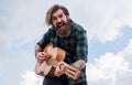 Bearded man being a rock star. casual male guitariston sky background. concept of music and vocal. man playing the Royalty Free Stock Photo