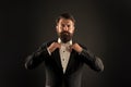 Bearded man with bow tie. Well dressed and scrupulously neat. Hipster formal suit tuxedo. Difference between vintage and Royalty Free Stock Photo