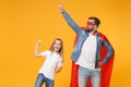 Bearded man in casual clothes Superman costume have fun with happy child baby girl. Father little kid daughter isolated Royalty Free Stock Photo