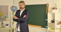 Bearded man in classroom chalkboard copy space. Graduation and final examination. School. Teacher school lesson. Study