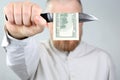 Bearded man closes a dollar bill and a knife face