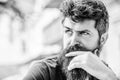 Bearded man concentrated face. Thoughtful mood concept. Making important choices. Man with beard and mustache thoughtful Royalty Free Stock Photo