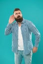 Bearded man concentrated on listening. Hearing problems. What. Eavesdrop on conversations. Deafness or hearing loss Royalty Free Stock Photo