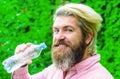 Bearded man drinking water. Male with bottle. Healthy lifestyle. Drinks water. Hydration concept. Stay hydrated.