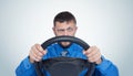 Bearded man driver with a steering wheel, auto concept Royalty Free Stock Photo