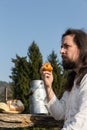 Bearded man eating an apple in the nature Royalty Free Stock Photo