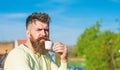 Bearded man with espresso mug, drinks coffee. Coffee break concept. Man with long beard looks strict and serious. Man Royalty Free Stock Photo