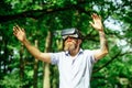 Bearded man with gadget travel in summer forest. Man with beard wear VR glasses on sunny outdoor. Hipster with mobile Royalty Free Stock Photo