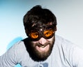 Bearded man in glasses plays the fool. crazy man, funny expression Royalty Free Stock Photo