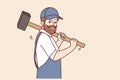 Bearded man with hammer works at construction site, dressed in overalls with cap