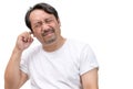 Bearded man has an itchy ear or a pain in his ear isolated on white background Royalty Free Stock Photo