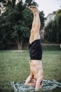 Sporty man practicing yoga outdoor