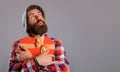 Bearded man with heart shaped gift box. Present with love. Time for presents. Valentines day. Copy space. Royalty Free Stock Photo