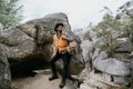 Bearded man hiker enjoy the view stand at cliff edge on mountain top Royalty Free Stock Photo