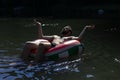 Bearded man, hipster resting floats on an inflatable circle on the river. concept outdoor recreation, stress relief