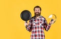 Bearded man hold kitchen pan. brutal hipster cooking with saucepan. housekeep husband cook in pot. mature chef in Royalty Free Stock Photo