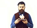 Bearded man holding notepad and moneybox with sad face