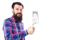 Bearded man holding used masonry tool isolated on white