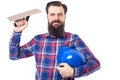 Bearded man holding used masonry tool