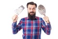 Bearded man holding used masonry tools