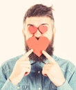 Bearded man holds symbols of love. Mature handsome man in love