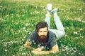 Bearded man laying on green grass Royalty Free Stock Photo