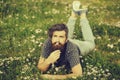 Bearded man laying on green grass Royalty Free Stock Photo