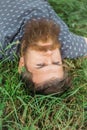 Bearded man laying on green grass Royalty Free Stock Photo
