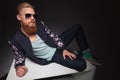 Bearded man laying on a studio table