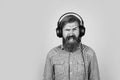 bearded man listen music. brutal hipster wear headphones. online education. just have fun. unshaven guy listening ebook